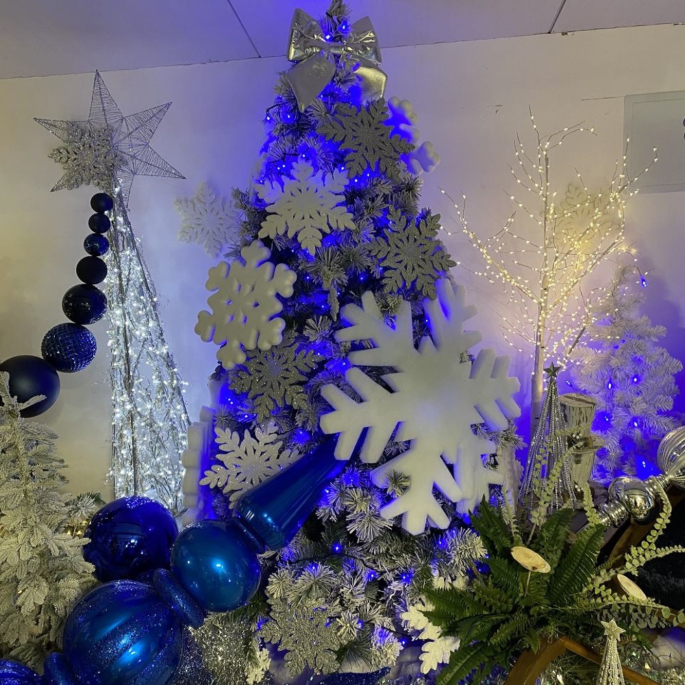 Artificial Green Flocked Christmas Tree - 210cm (7ft) Decorated With Silver & White Snowflakes & Blue Lights