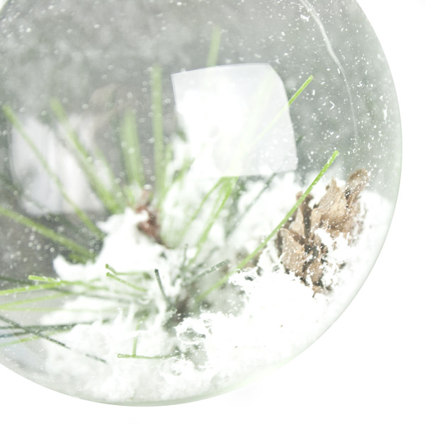 Clear Glass Bauble Containing Pinecones And Snow - 80mm